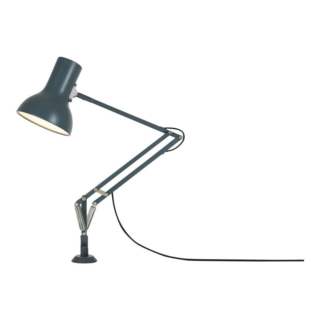 Matte black desk lamp with silver accents and a sleek, modern design, featuring articulated arms and a textured surface.
