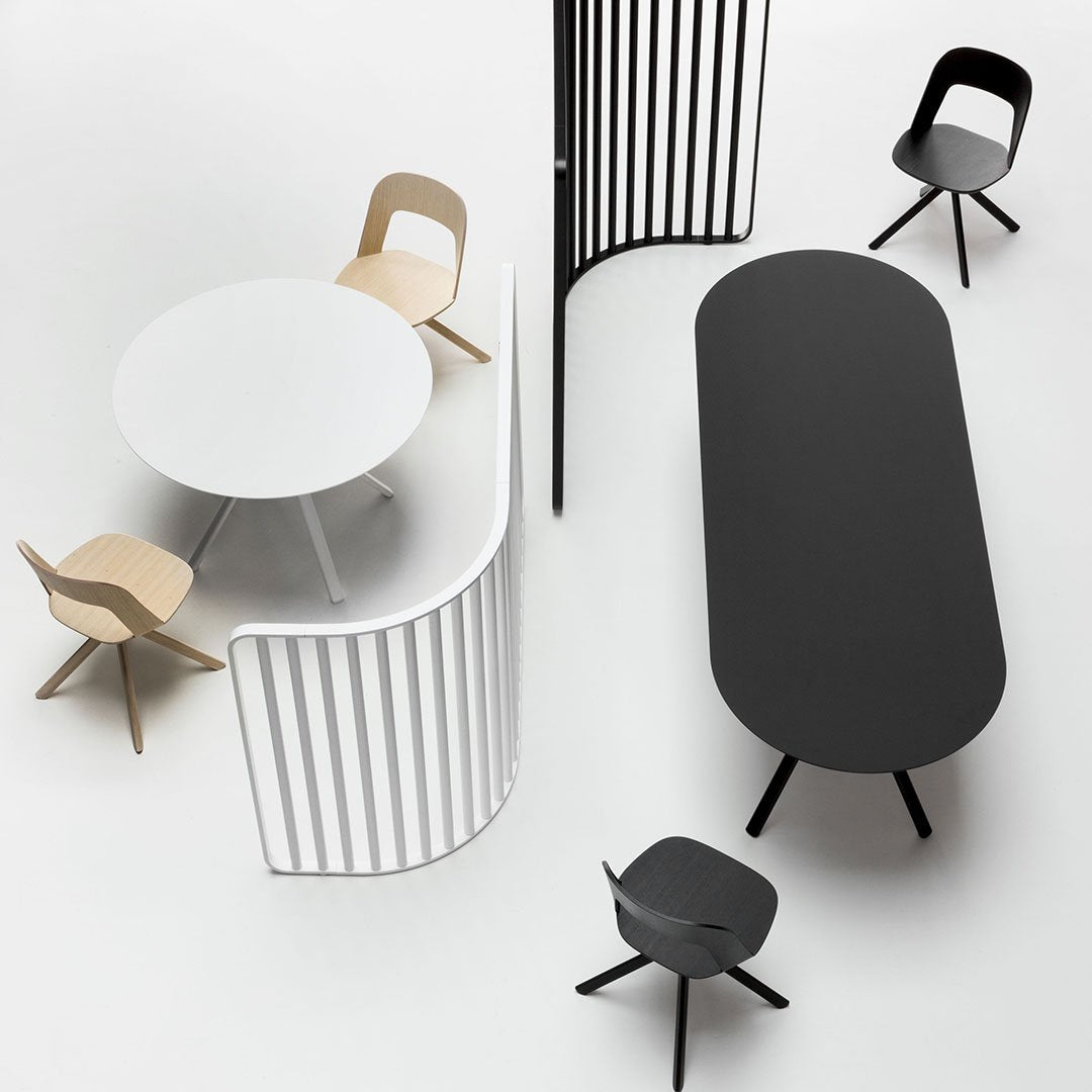 Modern furniture set featuring black, white, and natural wood colors with sleek, minimalist designs and curved patterns.