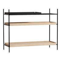 Modern black and natural wood shelf with simple lines and minimalistic design. Perfect for contemporary decor.
