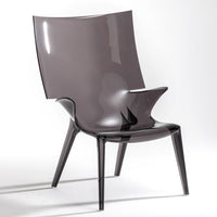 Sleek grey acrylic chair with a glossy finish and modern, minimalist design. Contemporary accent for any space.