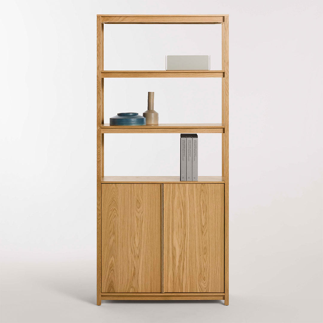 "Natural wood bookshelf with light oak finish, featuring smooth shelves and simple, modern design."