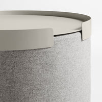 Gray felt storage container with a light gray lid. Smooth texture and minimalistic design. Ideal for modern decor.
