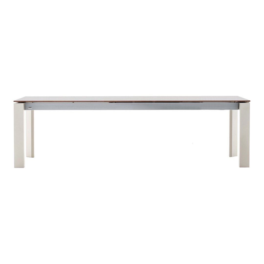Modern wooden dining table in light beige with a smooth white tabletop and minimalist design. Ideal for any decor.