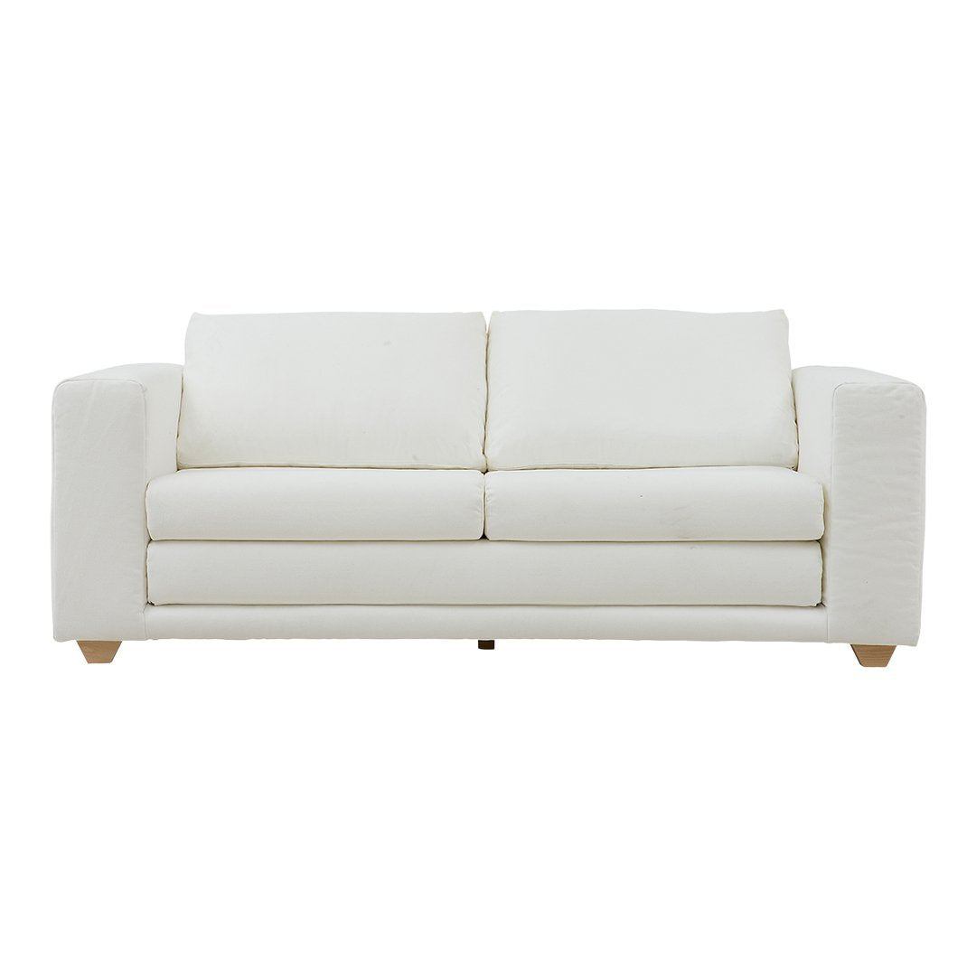 White minimalist sofa with soft fabric and two plush cushions, featuring natural wood legs and clean lines.