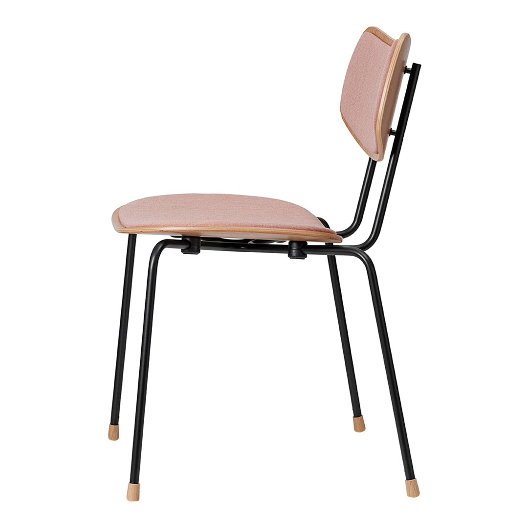 Minimalist black chair with soft pink seat and backrest, featuring simple, clean lines and wooden accents.