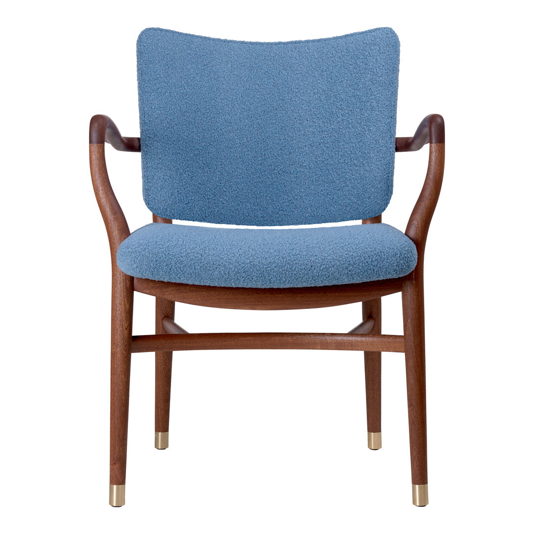 Blue upholstered chair with a textured fabric and a wooden frame featuring brass accents. Modern and stylish design.