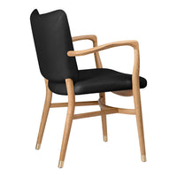Black upholstered chair with natural wood frame and curved armrests, showcasing a modern and minimalist design.