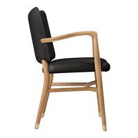 Black upholstered chair with natural wood frame, showcasing sleek design and modern elegance.
