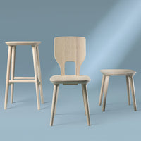 Light wood furniture set featuring a stool, chair, and side table against a soft blue background. Clean lines, minimalist design.