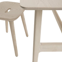 Light wood dining table and stool with smooth textures and natural grain patterns, perfect for minimalist decor.