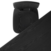 Black wooden table with a sleek, smooth finish and subtle, natural grain pattern.