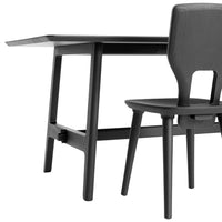 Black dining table and chair set with sleek, minimalist design and smooth finish. Ideal for modern interiors.