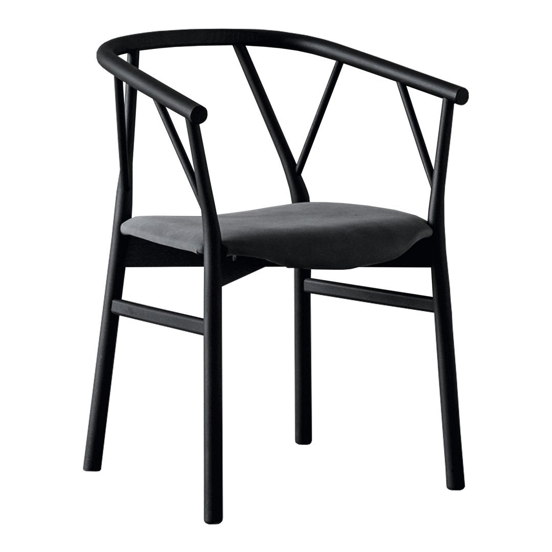 Black chair with a modern geometric design and a soft gray cushion. Sleek and stylish for any contemporary space.