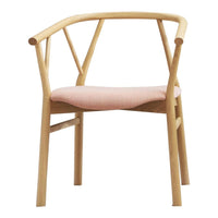 Light wood chair with a minimalist design and a soft pink fabric seat, featuring a modern crossed back pattern.
