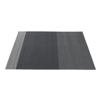Gray area rug featuring a modern striped pattern with varying shades of dark gray and light gray tones.