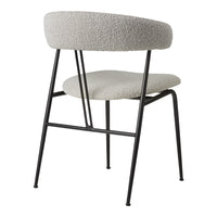 Modern chair in soft gray upholstery with a minimal black metal frame. Stylish and contemporary for any space.
