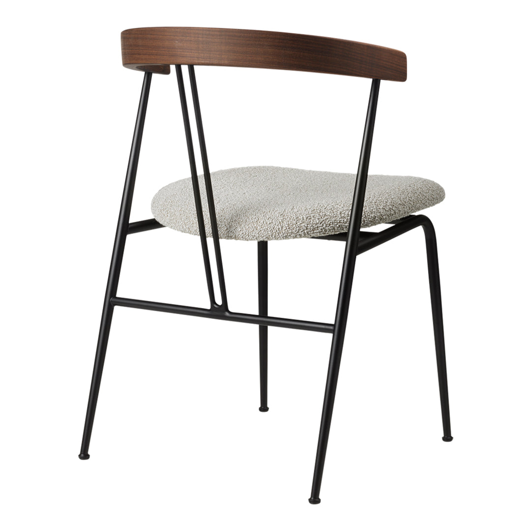 Modern chair featuring a warm wood backrest and a soft, textured light gray seat on sleek black metal legs.