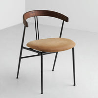 Mid-century chair with a warm beige seat and dark wood backrest, supported by sleek black metal legs.