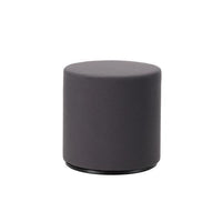 Dark grey upholstered round ottoman with a smooth, minimalistic design. Perfect for modern decor.