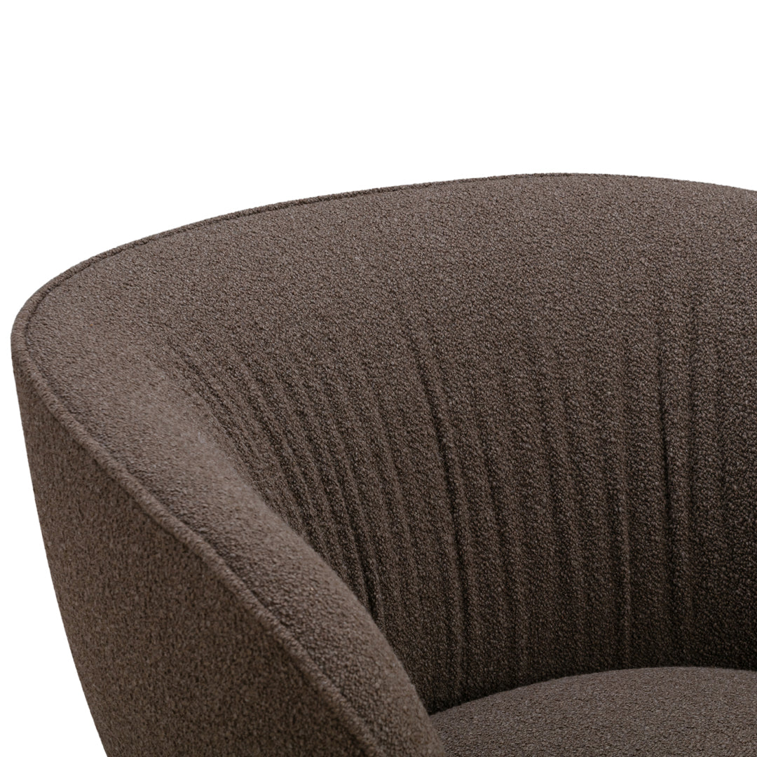 Textured brown upholstery with soft, ribbed patterns, perfect for a modern accent chair.