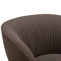Textured brown upholstery with soft, ribbed patterns, perfect for a modern accent chair.