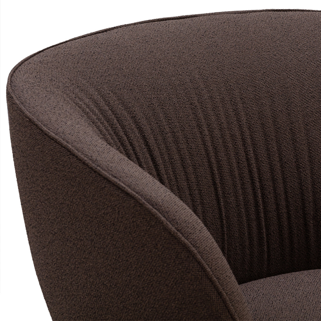 Brown textured armchair with vertical ribbed pattern, adding a modern touch to any space.