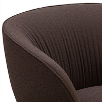 Brown textured armchair with vertical ribbed pattern, adding a modern touch to any space.