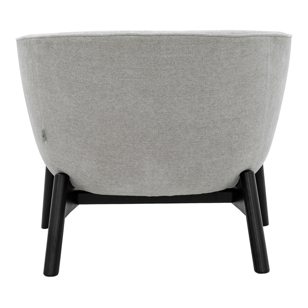 Gray upholstered planter pot with a smooth texture and black wooden legs, minimalist design. Perfect for modern decor.
