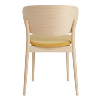 Light wood chair with a yellow cushion, featuring a smooth, minimalistic design and curved backrest.