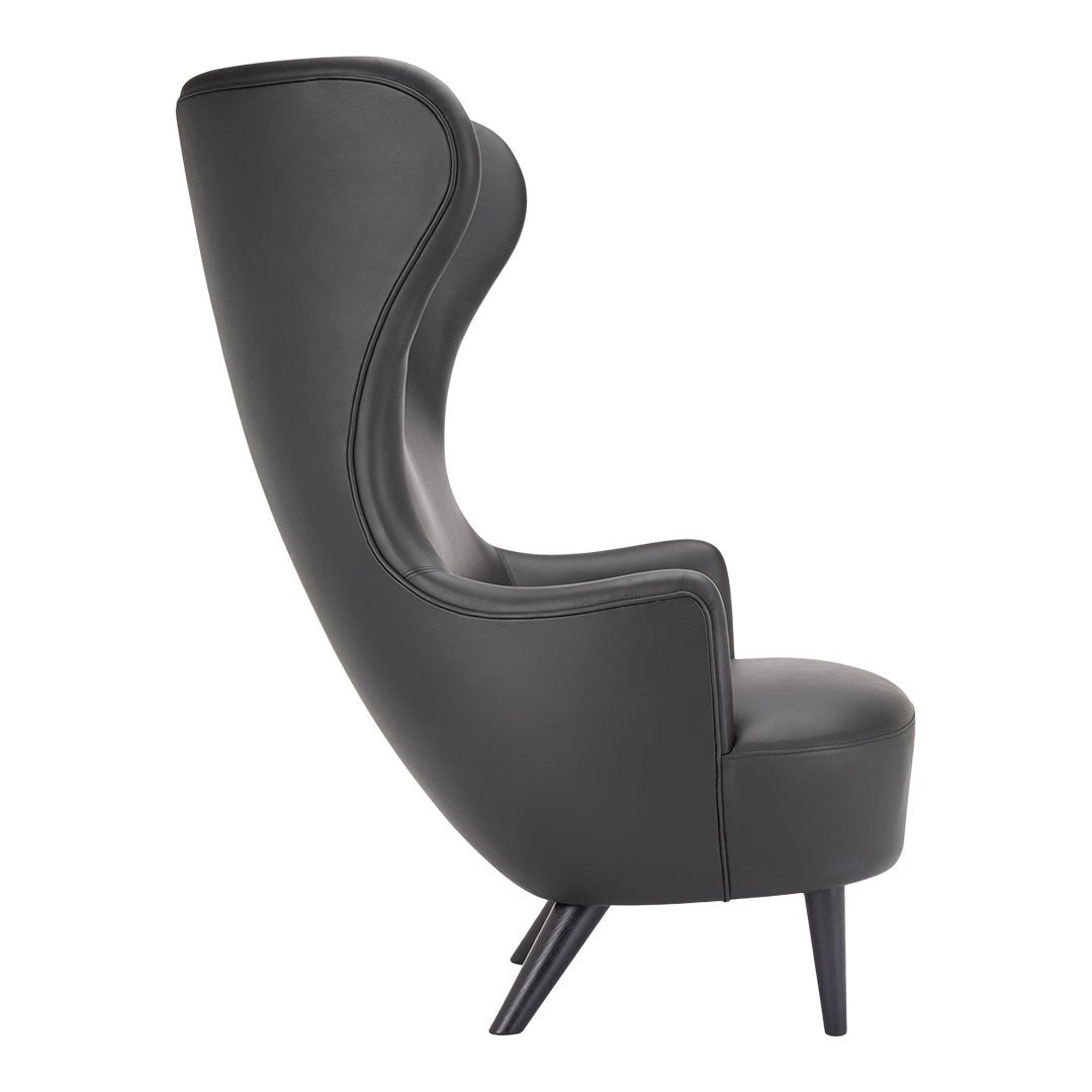 Stylish black leather high-back chair with sleek curved design and tapered wooden legs. Perfect for modern decor.