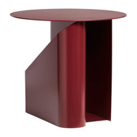 Modern round side table in deep burgundy with sleek, geometric design and matte finish. Ideal for contemporary decor.