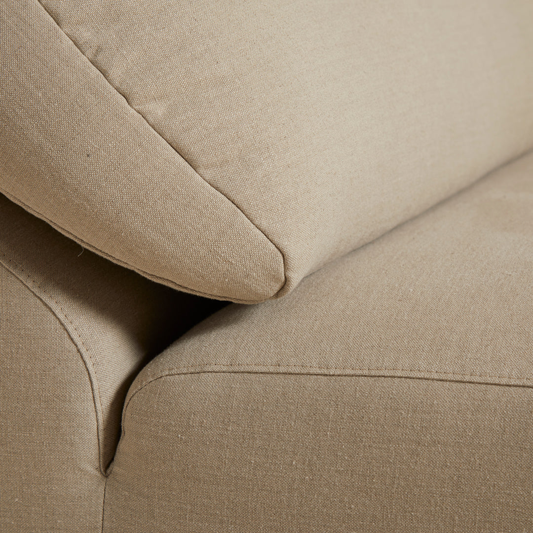 Beige linen upholstery with subtle texture and clean lines, perfect for modern living spaces.
