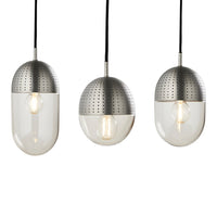Three hanging pendant lights featuring a sleek silver metallic top and a smooth white glass bottom with perforated patterns.