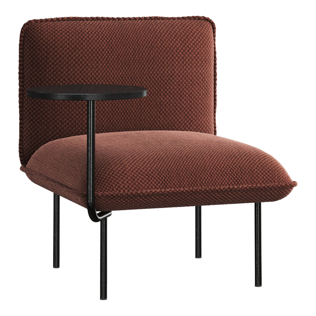 Rust-colored chair with textured fabric and minimalist black metal side table, perfect for modern décor.