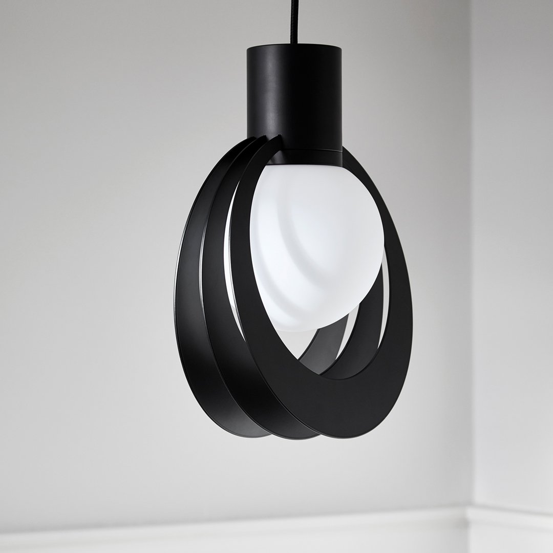 Black metal pendant lamp with a sleek design featuring a white glass orb and smooth, curved lines. Perfect for modern decor.