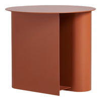 Round, modern side table in warm terracotta with a smooth matte finish and minimalist design.