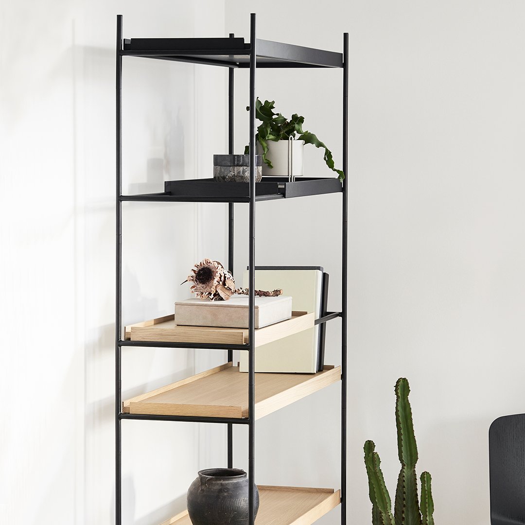 Sleek black metal shelf with natural wood shelves, featuring a minimalist design and elegant color contrast.
