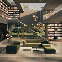 Modern living room with green upholstery, concrete tones, and wooden accents, featuring geometric patterns and natural light.