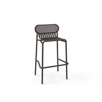 "Modern brown metal bar stool with sleek horizontal slat pattern on the backrest."
