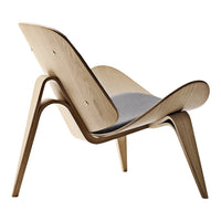 Natural wood finish with smooth curves and a gray fabric cushion, highlighting minimalist design and elegant style.