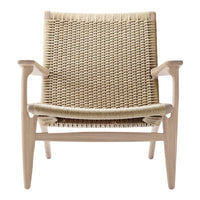 Natural woven chair in beige tones with a light wood frame and simple, clean lines. Perfect for minimalistic decor.