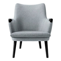 Gray upholstered armchair with sleek, minimalist design and black wooden legs. Soft texture enhances modern aesthetics.