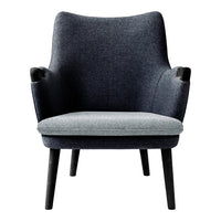 Gray and dark gray upholstery armchair with a minimalist design and black wooden legs.