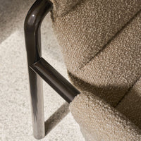 Beige textured fabric upholstery with a sleek black metal frame, adding modern elegance to any space.