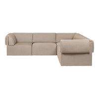 Beige sectional sofa with a minimalist design and clean lines, featuring soft, textured upholstery in a subtle weave pattern.