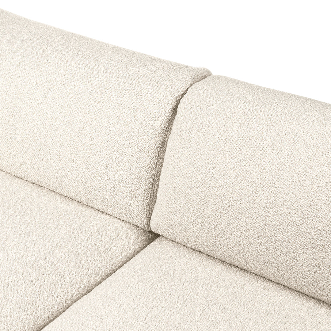 Cream textured fabric upholstery with a subtle, cozy pattern, perfect for modern living spaces.