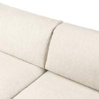 Cream textured fabric upholstery with a subtle, cozy pattern, perfect for modern living spaces.