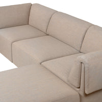 Beige sectional sofa with a modern, textured fabric design and clean, minimalist lines. Ideal for contemporary decor.