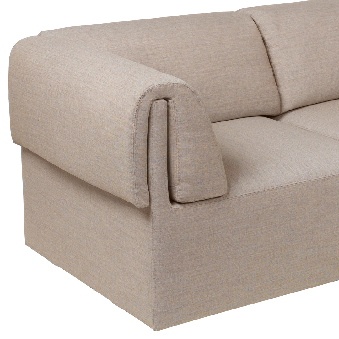 Beige textured sofa with a minimalist design and soft, clean lines. Ideal for modern living spaces.