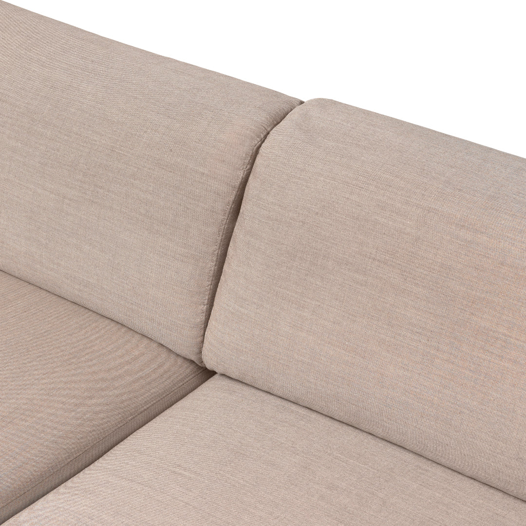 Beige textured fabric upholstery with subtle patterns, ideal for modern living spaces.